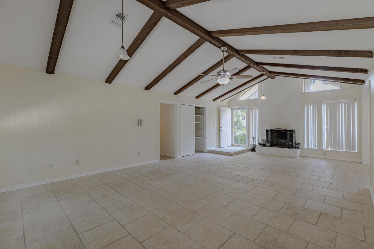Empty room, Fireplace, Interior, Pendant Lights, Stone Walls, Wooden Beams