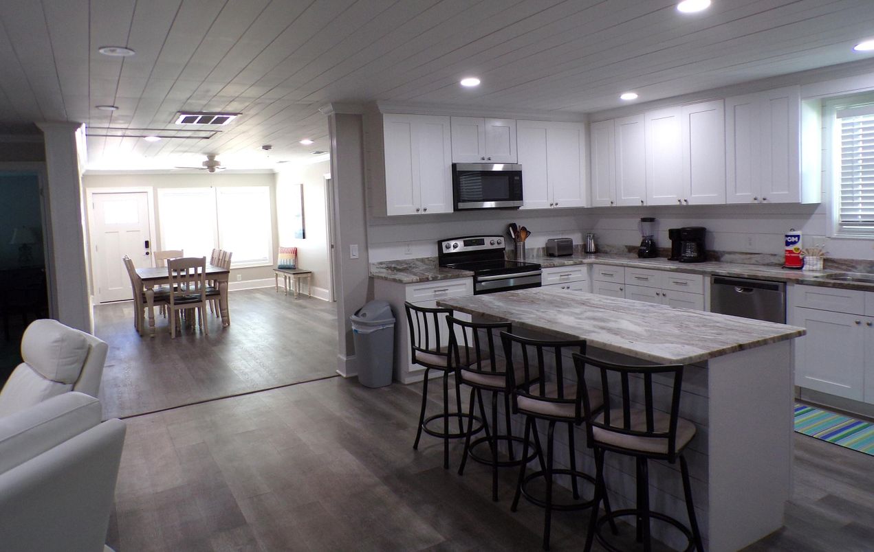 Dining room, Interior, Kitchen, Recessed Lighting, Stainless Steel Appliances, Wood Texture Flooring