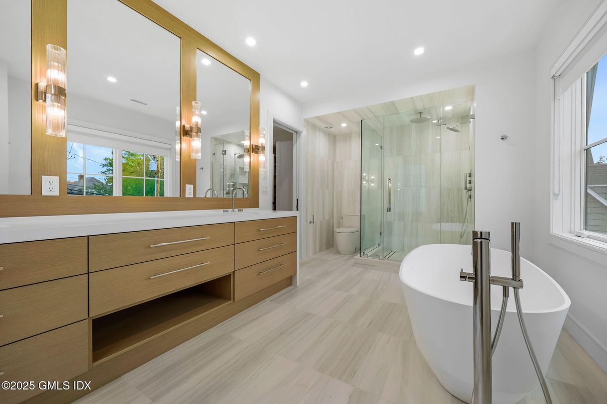 Bathroom, Dual Sink Vanities, Free Standing Baths, Glass Shower, Interior, Recessed Lighting, Wood Texture Flooring