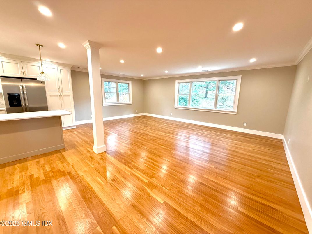 Empty room, Interior, Kitchen, Pendant Lights, Recessed Lighting, Stainless Steel Appliances, Wood Texture Flooring