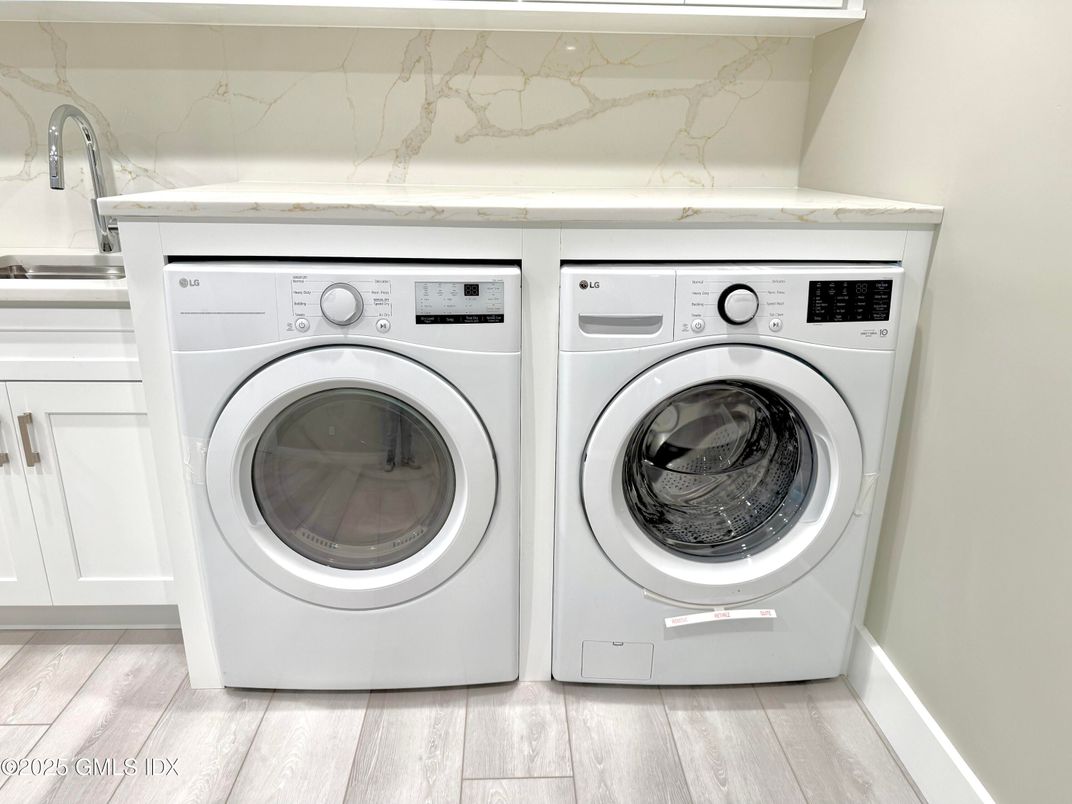 Interior, Marble Walls, Utility Closets, Washer, Wood Texture Flooring