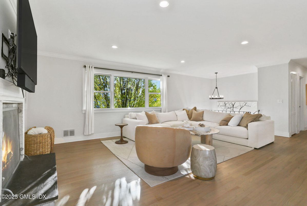 Dining room, Fireplace, Interior, Living room, Pendant Lights, Recessed Lighting, Wood Texture Flooring