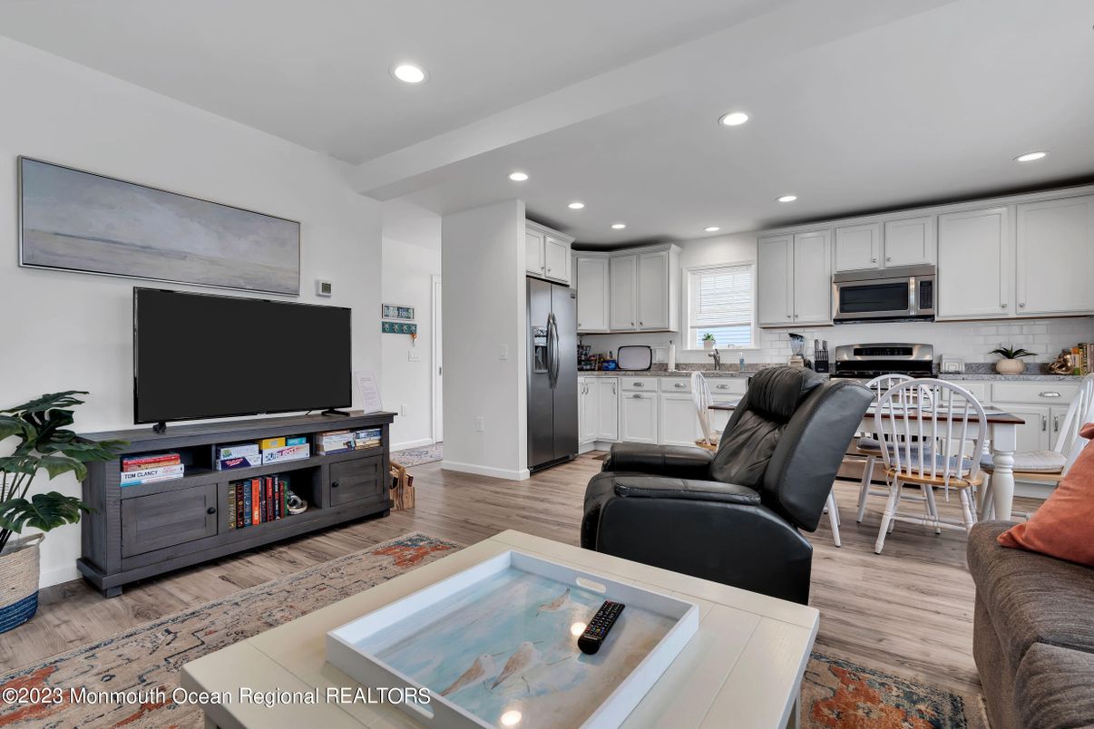 Dining room, Interior, Kitchen, Living room, Recessed Lighting, Stainless Steel Appliances, Wood Texture Flooring