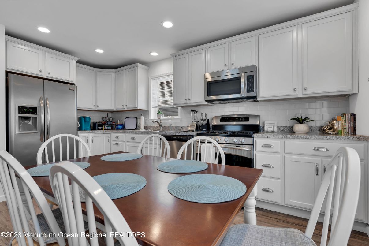 Dining room, Interior, Kitchen, Recessed Lighting, Stainless Steel Appliances, Wood Texture Flooring