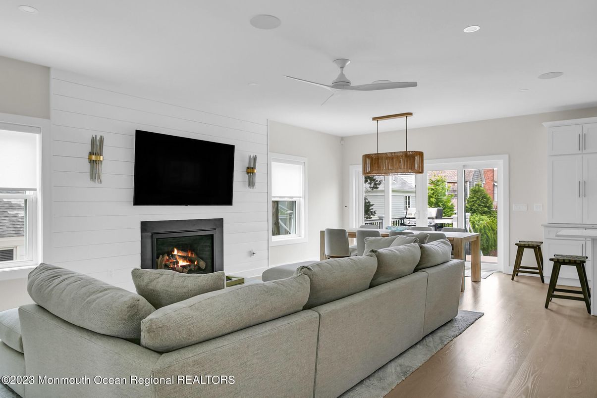 Dining room, Fireplace, Interior, Living room, Pendant Lights, Recessed Lighting, Wood Texture Flooring