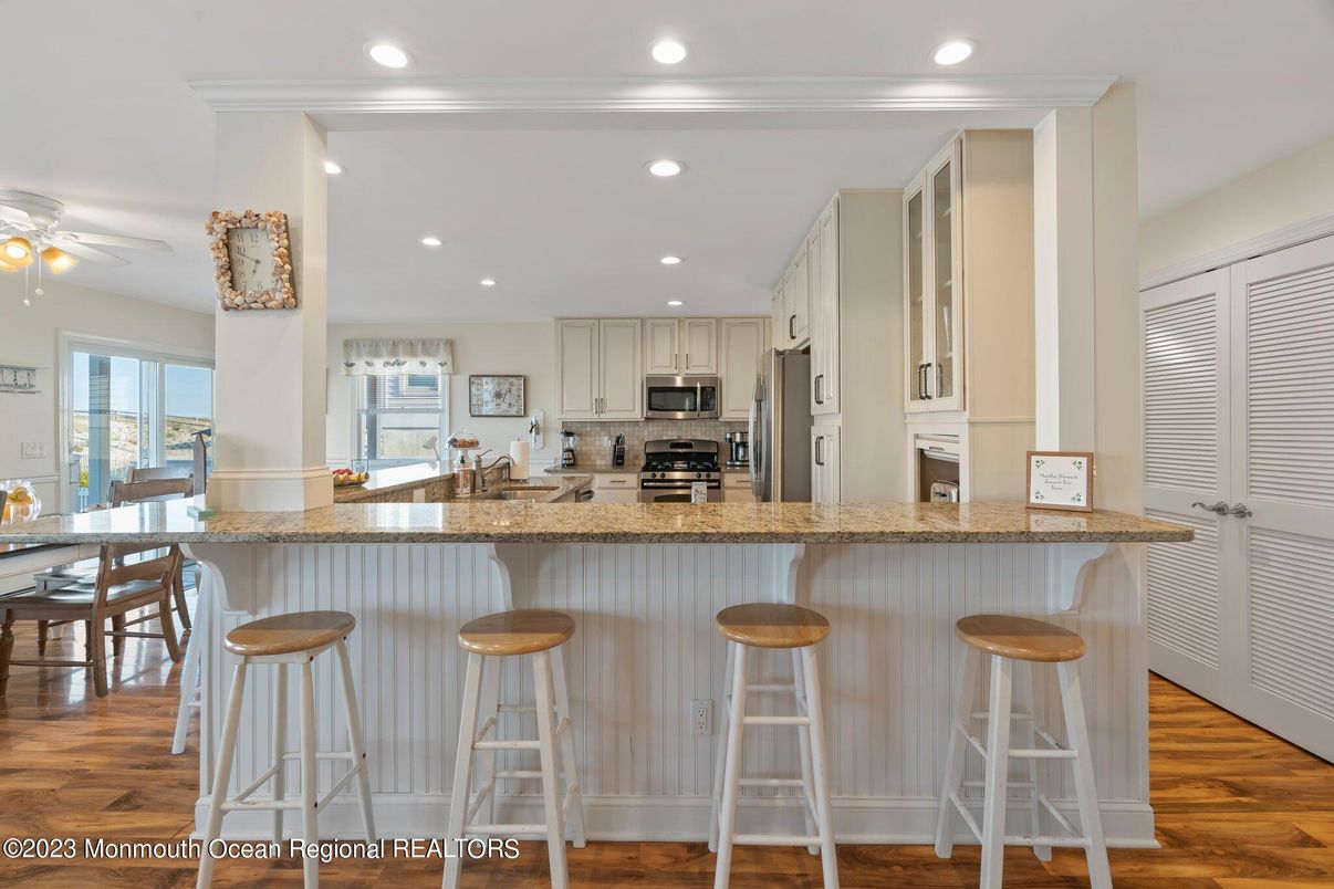 Dining room, Interior, Kitchen, Recessed Lighting, Stainless Steel Appliances, Wood Texture Flooring