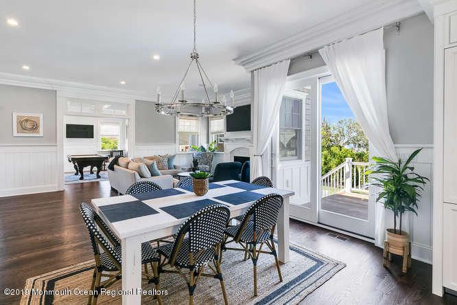 Chandelier, Dining room, Fireplace, Interior, Living room, Pendant Lights, Recessed Lighting, Wood Texture Flooring