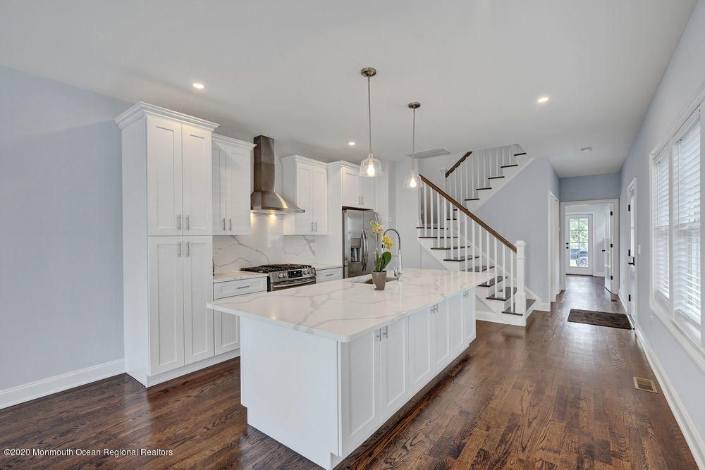 Interior, Kitchen, Marble Walls, Pendant Lights, Recessed Lighting, Stainless Steel Appliances, Wood Texture Flooring