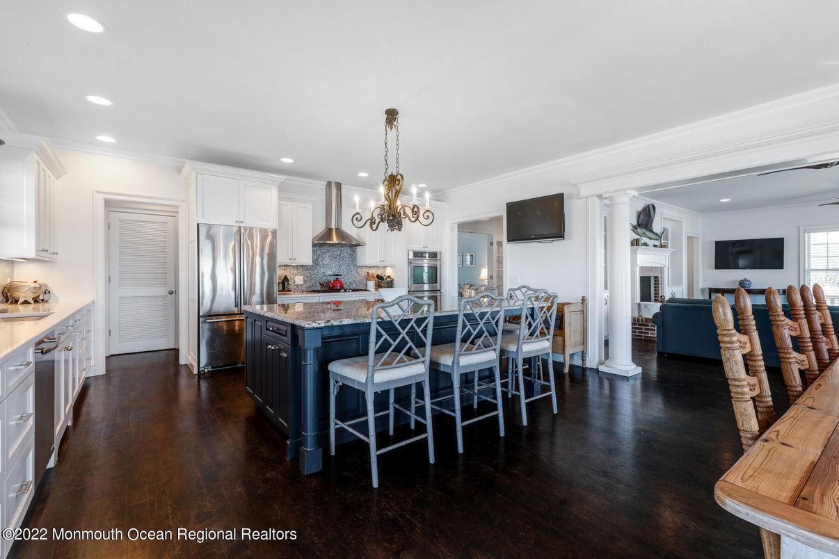 Chandelier, Dining room, Fireplace, Interior, Kitchen, Recessed Lighting, Stainless Steel Appliances, Wood Texture Flooring