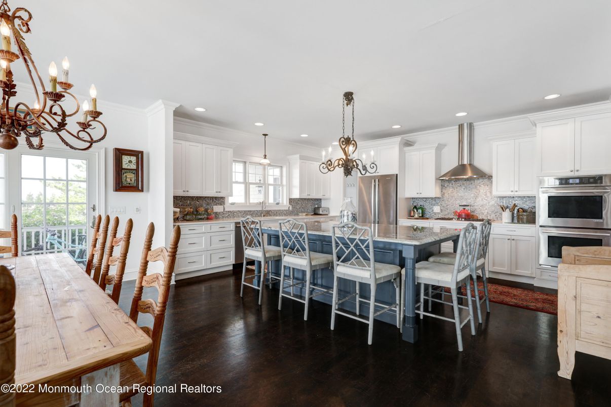Chandelier, Dining room, Interior, Kitchen, Pendant Lights, Recessed Lighting, Stainless Steel Appliances, Wood Texture Flooring