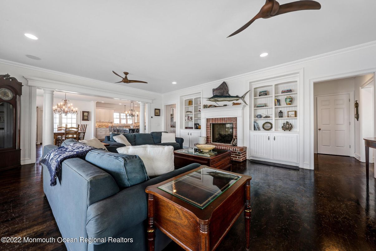 Chandelier, Dining room, Fireplace, Interior, Living room, Recessed Lighting, Wood Texture Flooring
