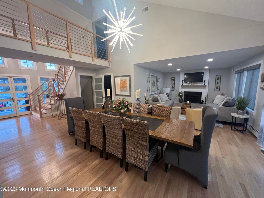 Dining room, Fireplace, Interior, Living room, Pendant Lights, Recessed Lighting, Wood Texture Flooring