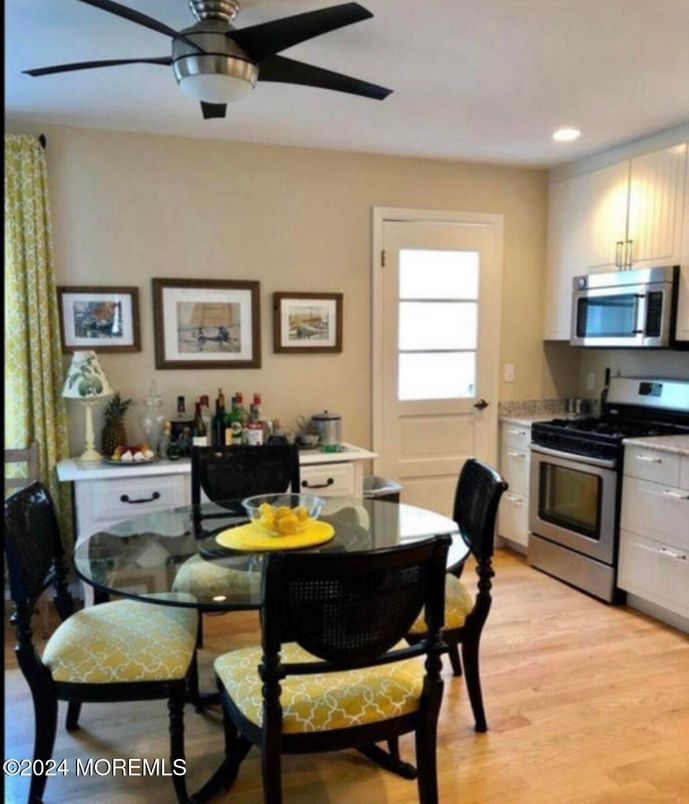 Dining room, Interior, Kitchen, Recessed Lighting, Stainless Steel Appliances, Wood Texture Flooring