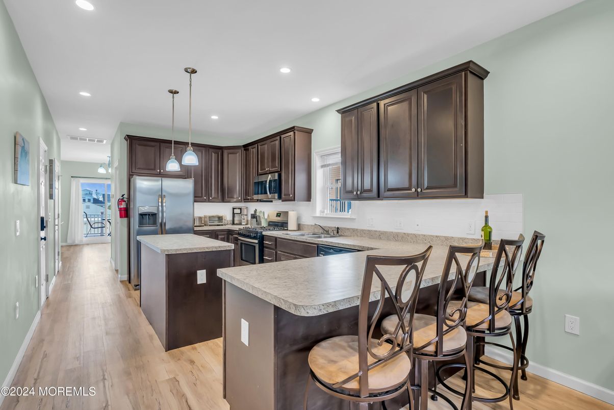 Interior, Kitchen, Pendant Lights, Recessed Lighting, Stainless Steel Appliances, Wood Texture Flooring