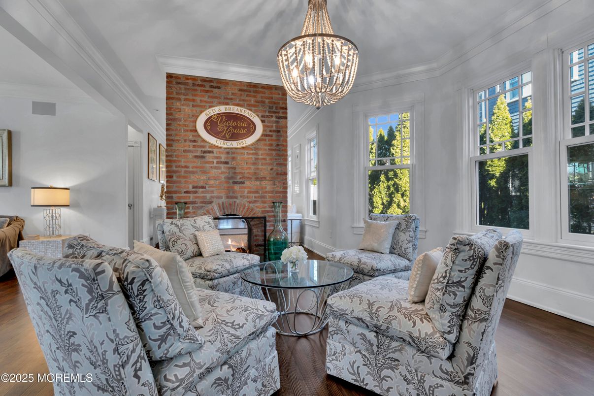 Chandelier, Fireplace, Interior, Living room, Stone Walls, Wood Texture Flooring
