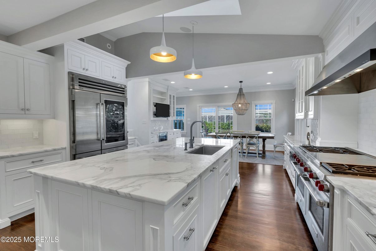 Chandelier, Dining room, Interior, Kitchen, Pendant Lights, Recessed Lighting, Stainless Steel Appliances, Wood Texture Flooring