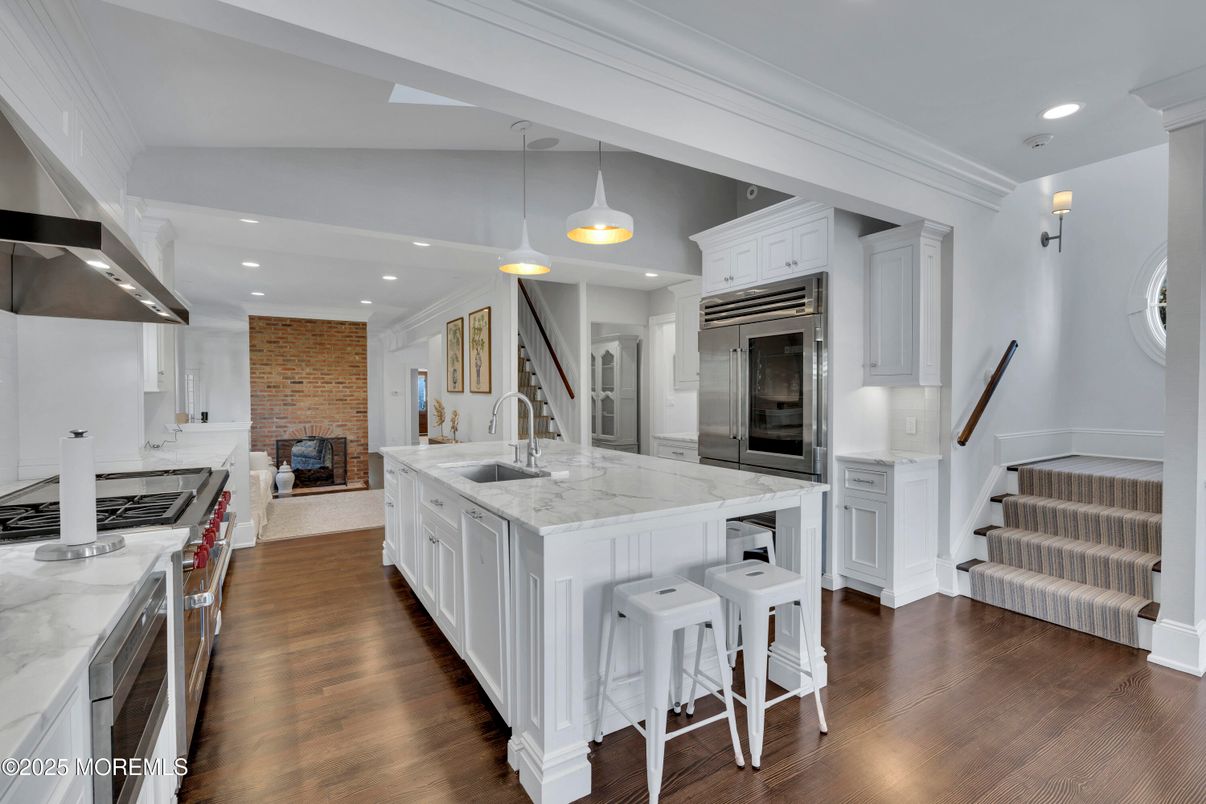 Interior, Kitchen, Pendant Lights, Recessed Lighting, Stainless Steel Appliances, Stone Walls, Wood Texture Flooring