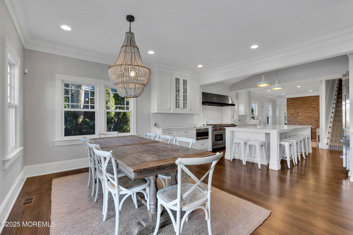 Chandelier, Dining room, Interior, Kitchen, Pendant Lights, Recessed Lighting, Stainless Steel Appliances, Wood Texture Flooring