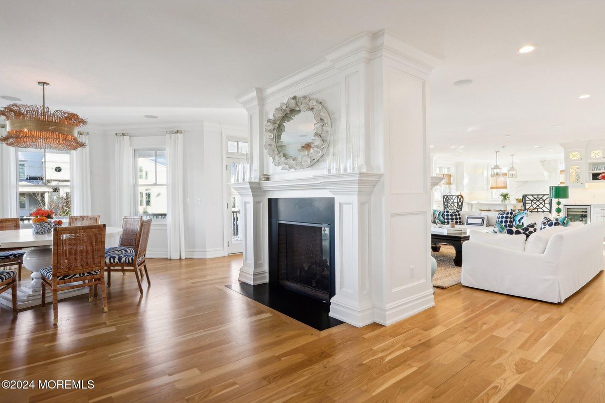 Chandelier, Dining room, Fireplace, Interior, Living room, Pendant Lights, Recessed Lighting, Wood Texture Flooring