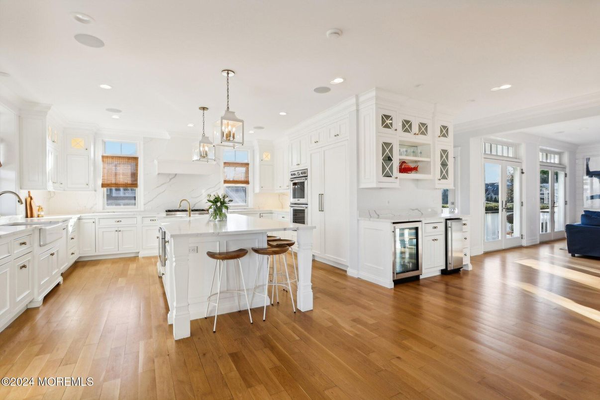 Interior, Kitchen, Marble Walls, Pendant Lights, Recessed Lighting, Stainless Steel Appliances, Wood Texture Flooring