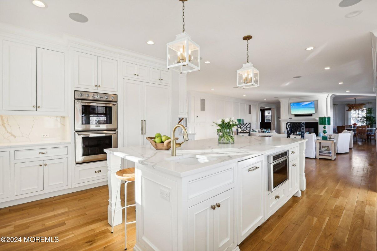 Fireplace, Interior, Kitchen, Living room, Pendant Lights, Recessed Lighting, Stainless Steel Appliances, Wood Texture Flooring