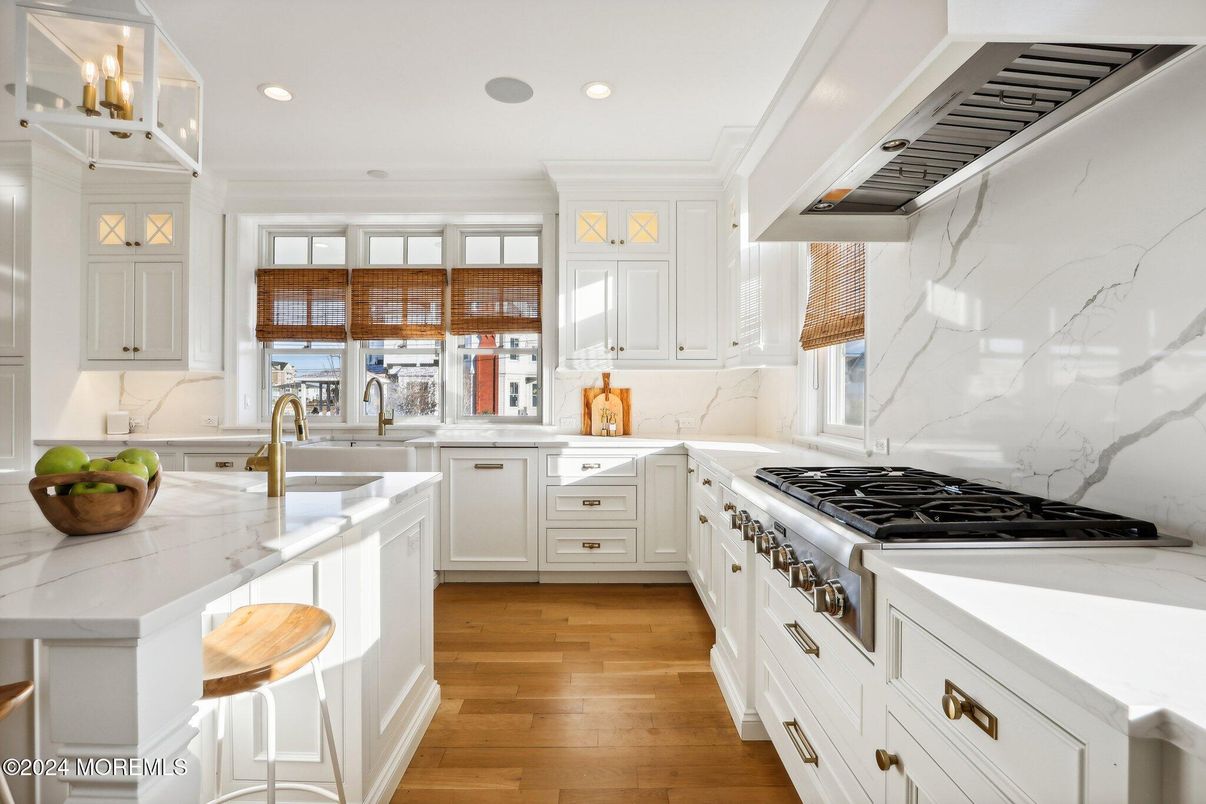 Interior, Kitchen, Marble Walls, Recessed Lighting, Stainless Steel Appliances, Wood Texture Flooring