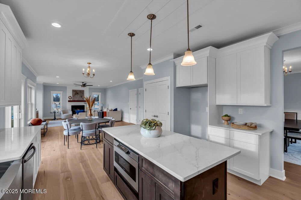 Dining room, Fireplace, Interior, Kitchen, Pendant Lights, Recessed Lighting, Wood Texture Flooring