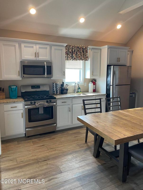 Dining room, Interior, Kitchen, Recessed Lighting, Stainless Steel Appliances, Wood Texture Flooring