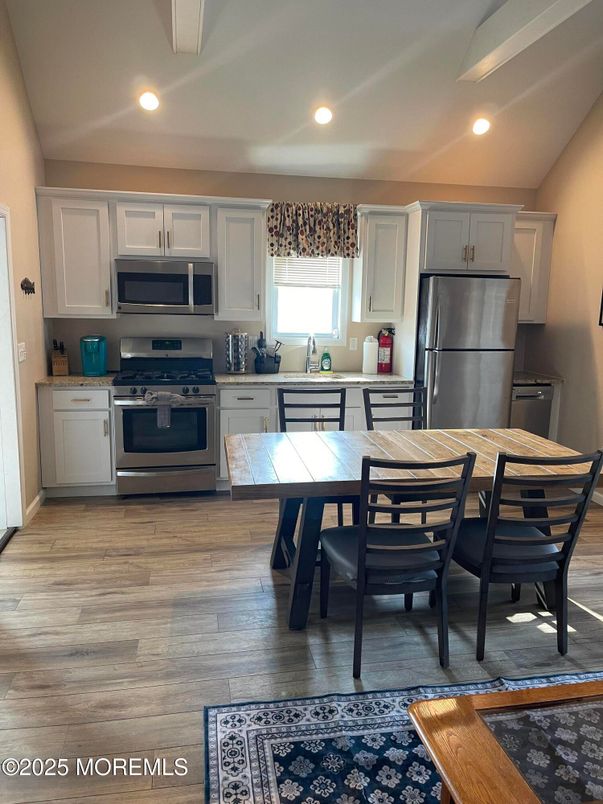 Dining room, Interior, Kitchen, Recessed Lighting, Stainless Steel Appliances, Wood Texture Flooring
