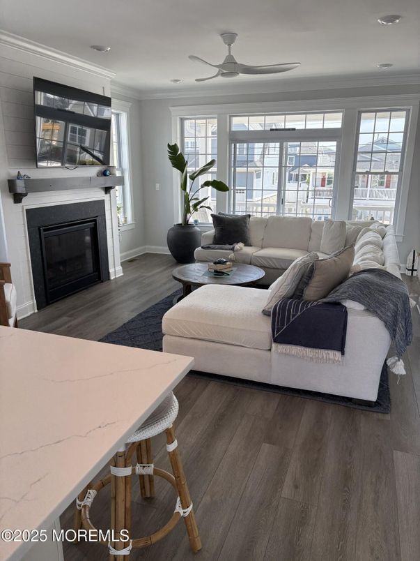 Dining room, Fireplace, Interior, Living room, Recessed Lighting, Wood Texture Flooring
