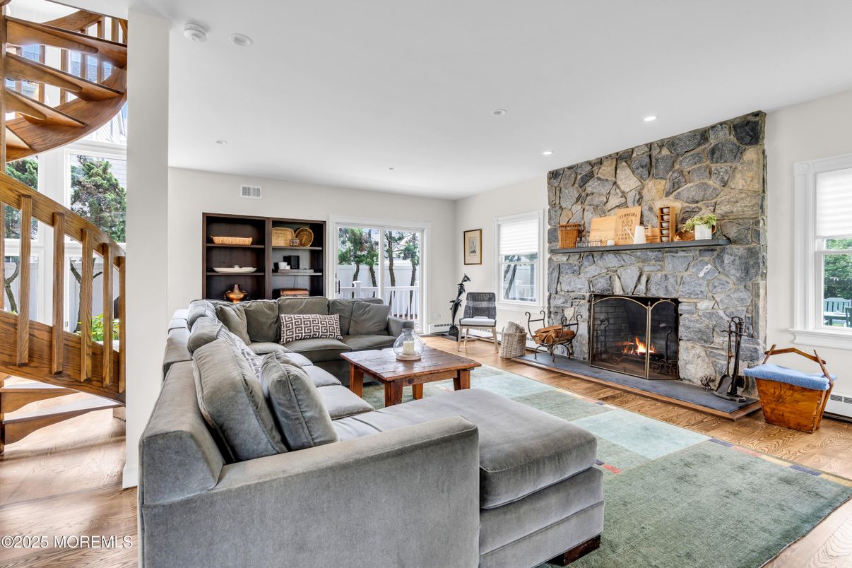 Fireplace, Interior, Living room, Recessed Lighting, Stone Walls, Wood Texture Flooring