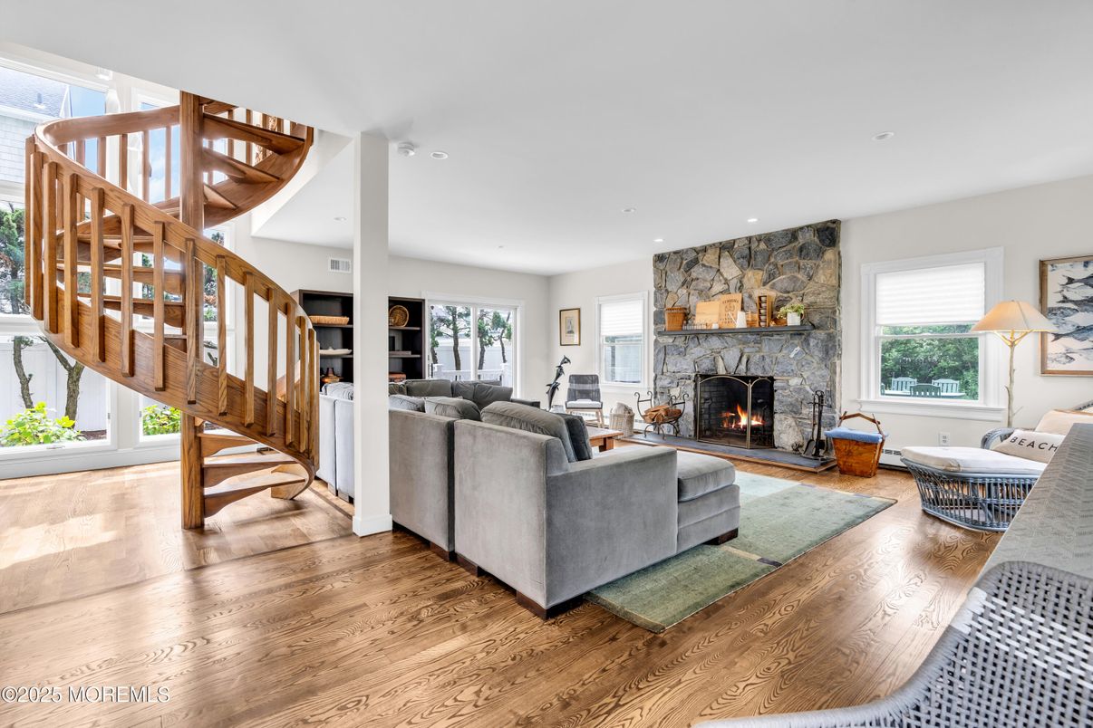 Fireplace, Interior, Living room, Recessed Lighting, Stone Walls, Wood Texture Flooring