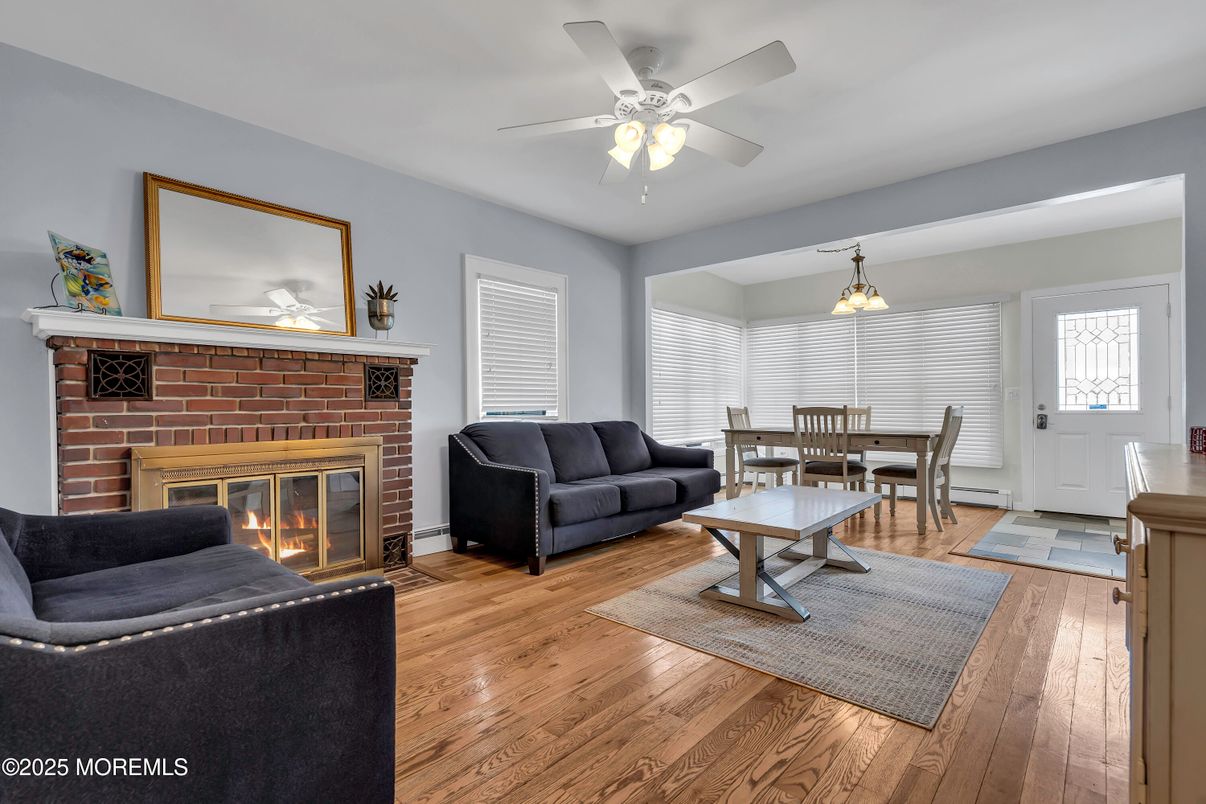 Dining room, Fireplace, Interior, Living room, Pendant Lights, Stone Walls, Wood Texture Flooring