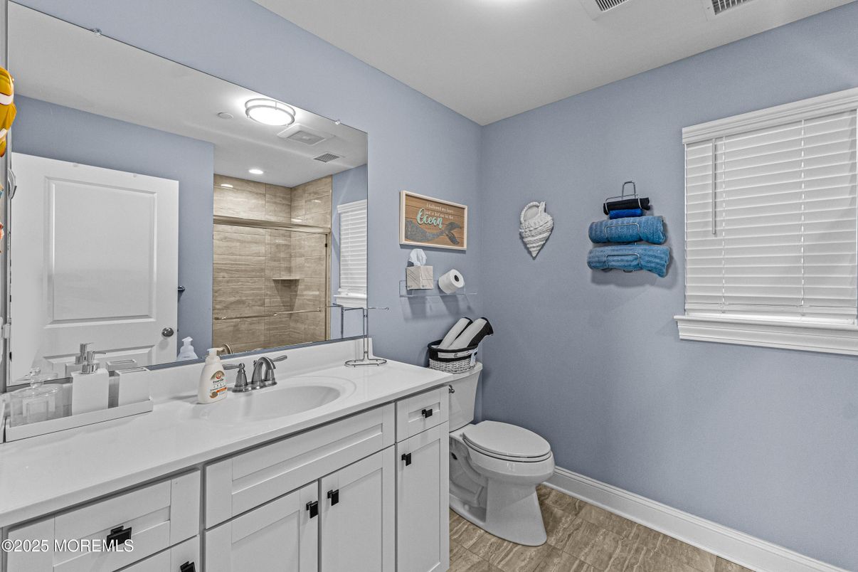 Bathroom, Dual Sink Vanities, Glass Shower, Interior, Recessed Lighting, Wood Texture Flooring