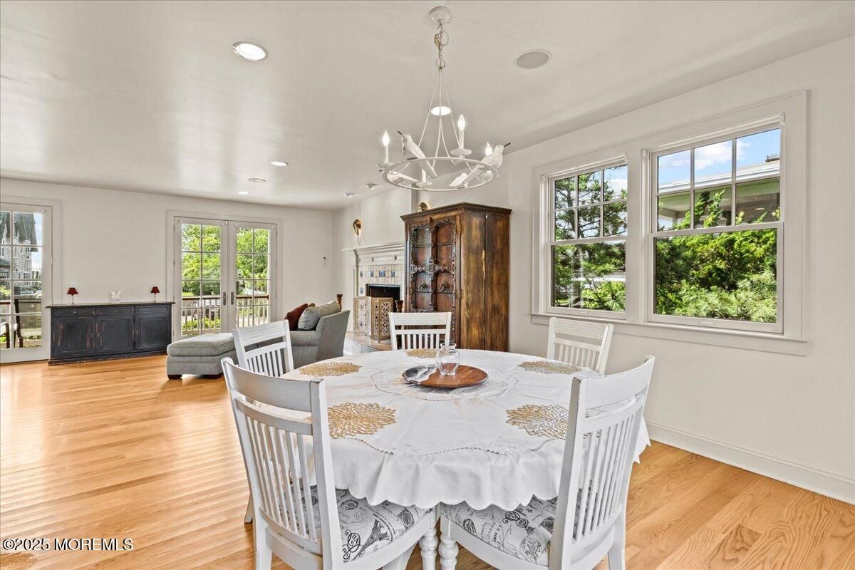 Dining room, Fireplace, Interior, Living room, Pendant Lights, Recessed Lighting, Wood Texture Flooring