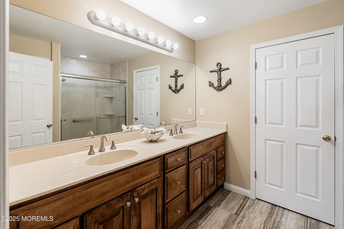 Bathroom, Dual Sink Vanities, Glass Shower, Interior, Recessed Lighting, Wood Texture Flooring