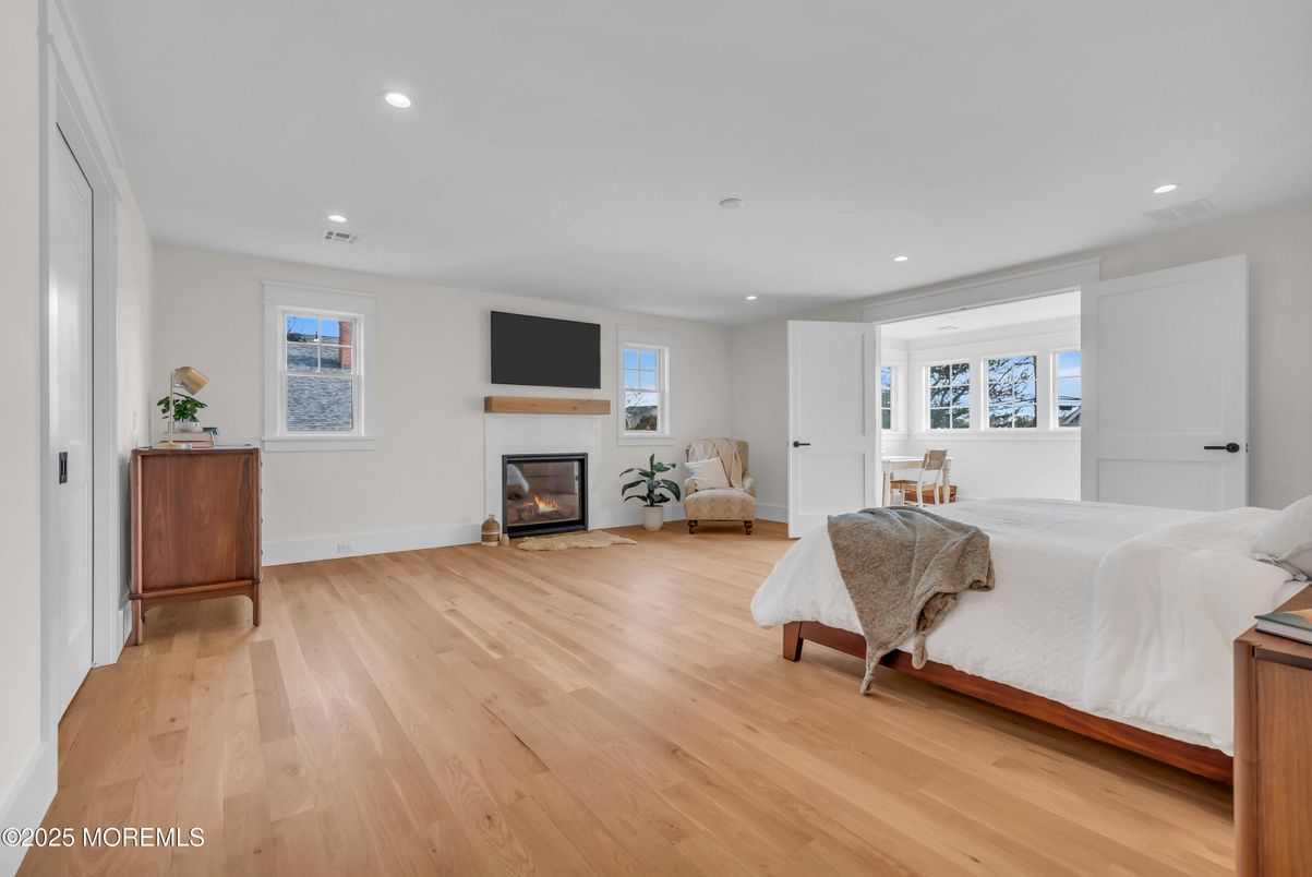 Bedroom, Fireplace, Interior, Recessed Lighting, Wood Texture Flooring