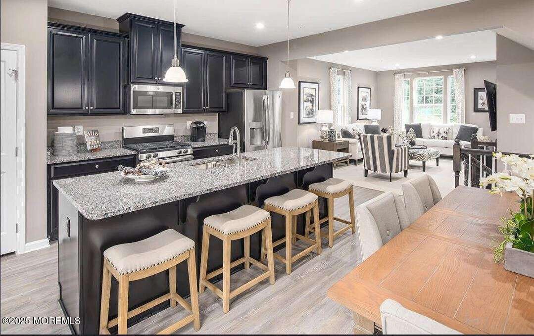 Dining room, Interior, Kitchen, Living room, Pendant Lights, Recessed Lighting, Stainless Steel Appliances, Wood Texture Flooring