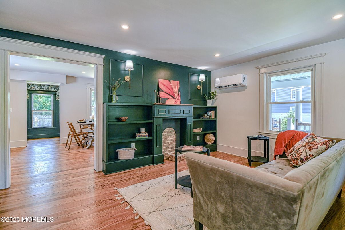 Dining room, Fireplace, Interior, Living room, Recessed Lighting, Wood Texture Flooring