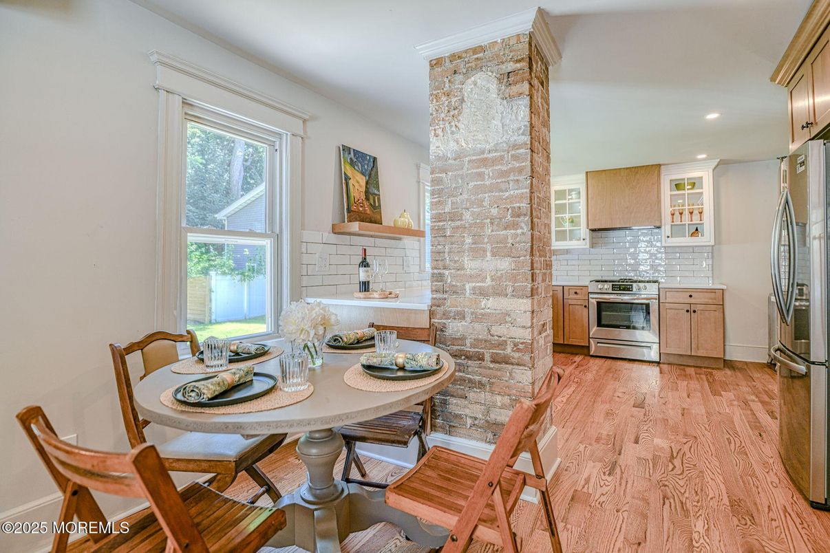 Dining room, Interior, Kitchen, Recessed Lighting, Stainless Steel Appliances, Stone Walls, Wood Texture Flooring