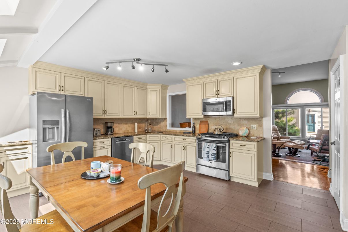 Dining room, Interior, Kitchen, Recessed Lighting, Stainless Steel Appliances, Wood Texture Flooring
