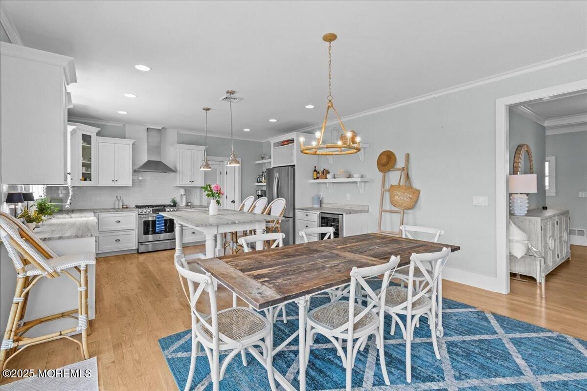 Dining room, Interior, Kitchen, Pendant Lights, Recessed Lighting, Stainless Steel Appliances, Wood Texture Flooring