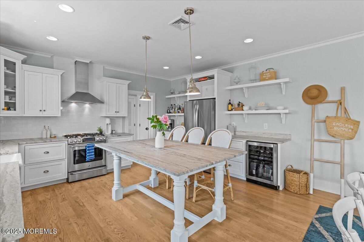 Dining room, Interior, Kitchen, Pendant Lights, Recessed Lighting, Stainless Steel Appliances, Wood Texture Flooring