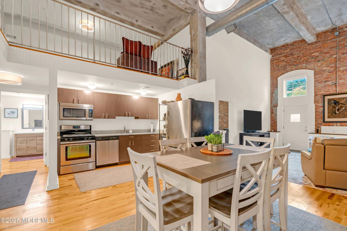 Dining room, Interior, Kitchen, Living room, Pendant Lights, Stainless Steel Appliances, Stone Walls, Wood Texture Flooring