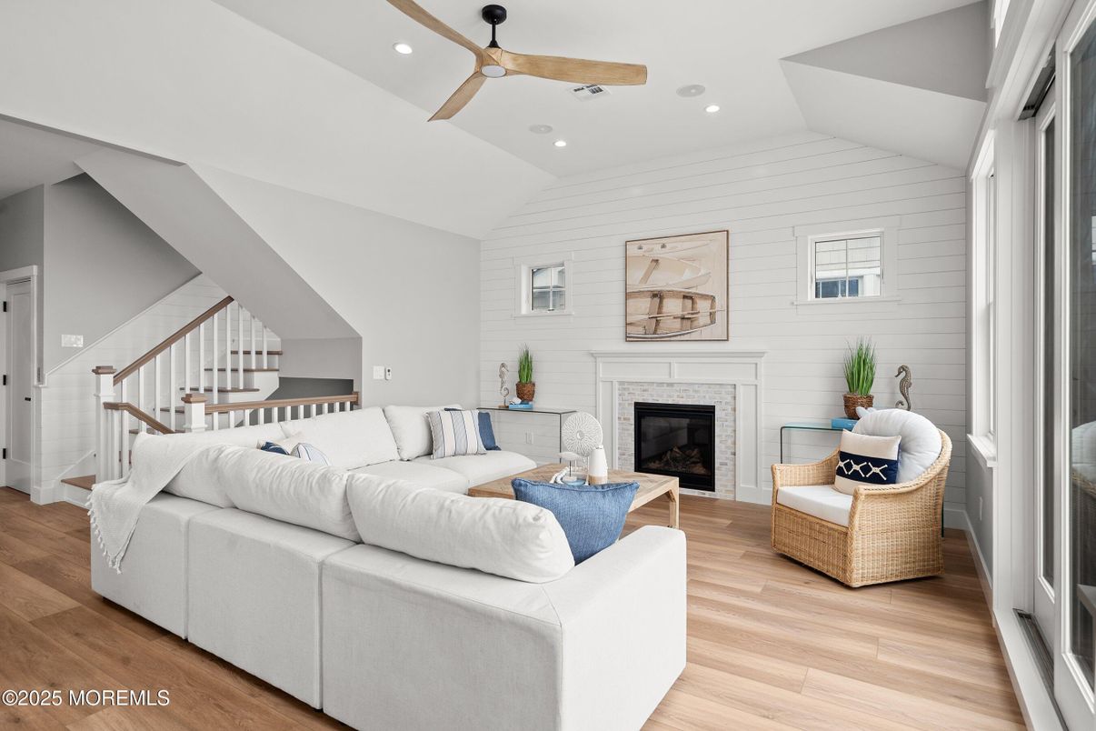 Fireplace, Interior, Living room, Recessed Lighting, Stone Walls, Wood Texture Flooring