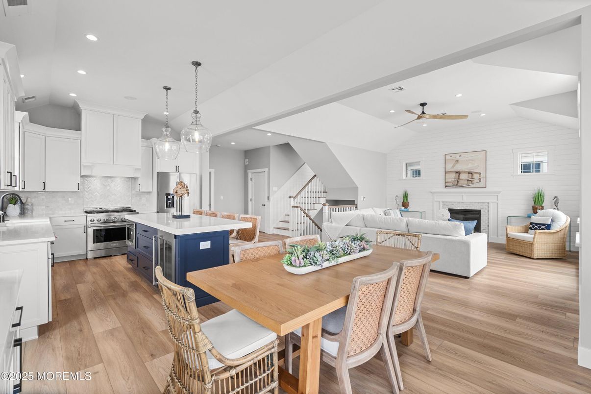 Dining room, Fireplace, Interior, Kitchen, Living room, Pendant Lights, Recessed Lighting, Stainless Steel Appliances, Stone Walls, Wood Texture Flooring