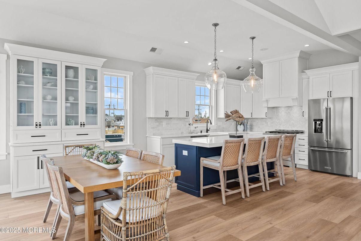 Dining room, Interior, Kitchen, Pendant Lights, Recessed Lighting, Stainless Steel Appliances, Wood Texture Flooring