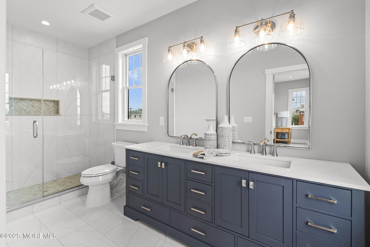 Bathroom, Dual Sink Vanities, Glass Shower, Interior, Marble Walls, Recessed Lighting