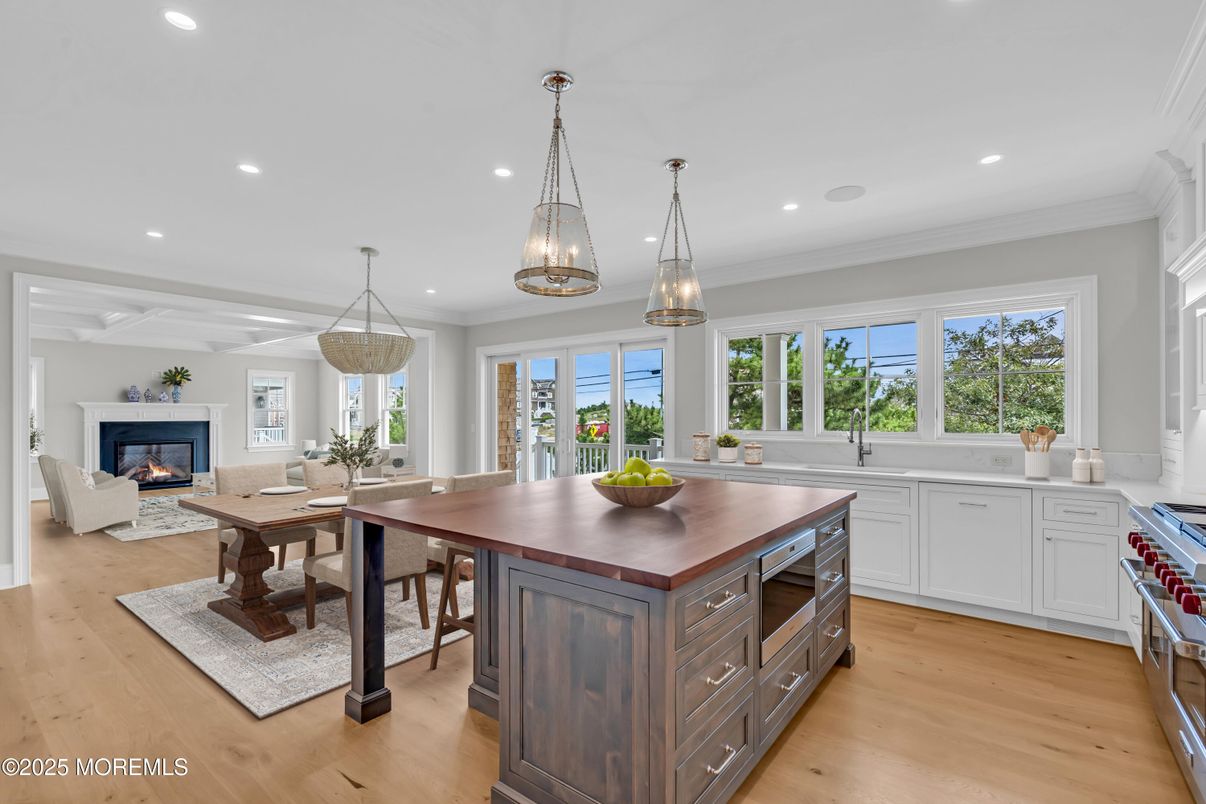 Chandelier, Dining room, Fireplace, Interior, Kitchen, Living room, Pendant Lights, Recessed Lighting, Wood Texture Flooring