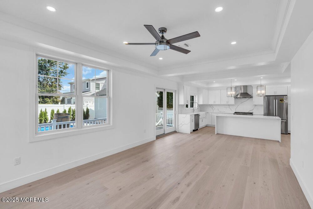 Interior, Kitchen, Marble Walls, Pendant Lights, Recessed Lighting, Stainless Steel Appliances, Wood Texture Flooring